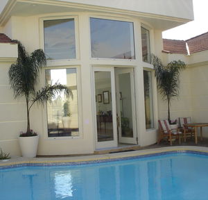 swing French door / pivoting with offset axis / aluminum / thermal break