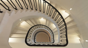 helical staircase / steel frame / stone steps / with risers
