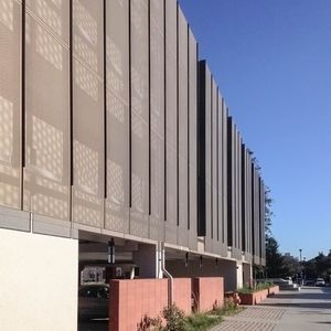 aluminum solar shading / for facades / perforated / vertical
