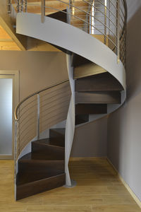 spiral staircase / metal frame / wooden steps / without risers