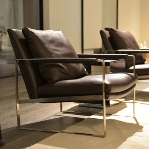 contemporary armchair / leather / wool / stainless steel