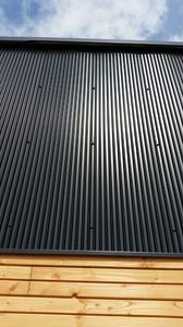 steel cladding / grooved / panel