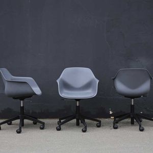 contemporary visitor chair / with armrests / upholstered / on casters
