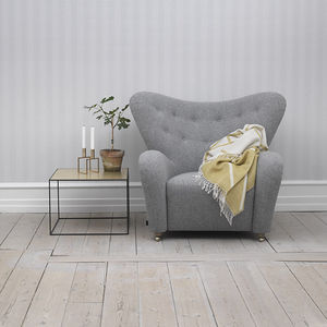 Scandinavian design armchair / sheep skin / with footrest / wing