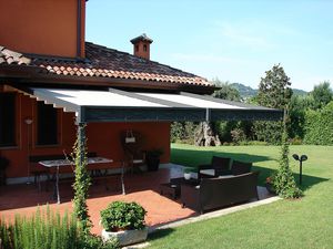 wall-mounted pergola / wrought iron / PVC fabric sliding canopy / custom
