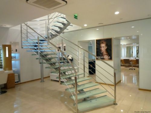circular staircase with central stringer for commercial buildings (metal frame and glass steps) ELCDES la stylique