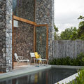 outdoor armchair / in metallic / contemporary - CORAIL by Hans Daalder