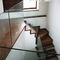 quarter-turn staircase with a central stringer (metal frame and wood steps) FULHAM, LONDON Flight Design