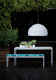 contemporary bench and table set for garden by Gae Aulenti