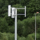 small three-bladed vertical axis wind turbine (Darrieus rotor)