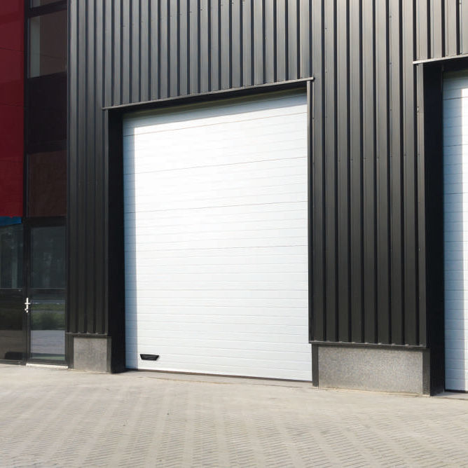 Sectional industrial door Delta Overlap sheet steel / thermallyinsulated / automatic