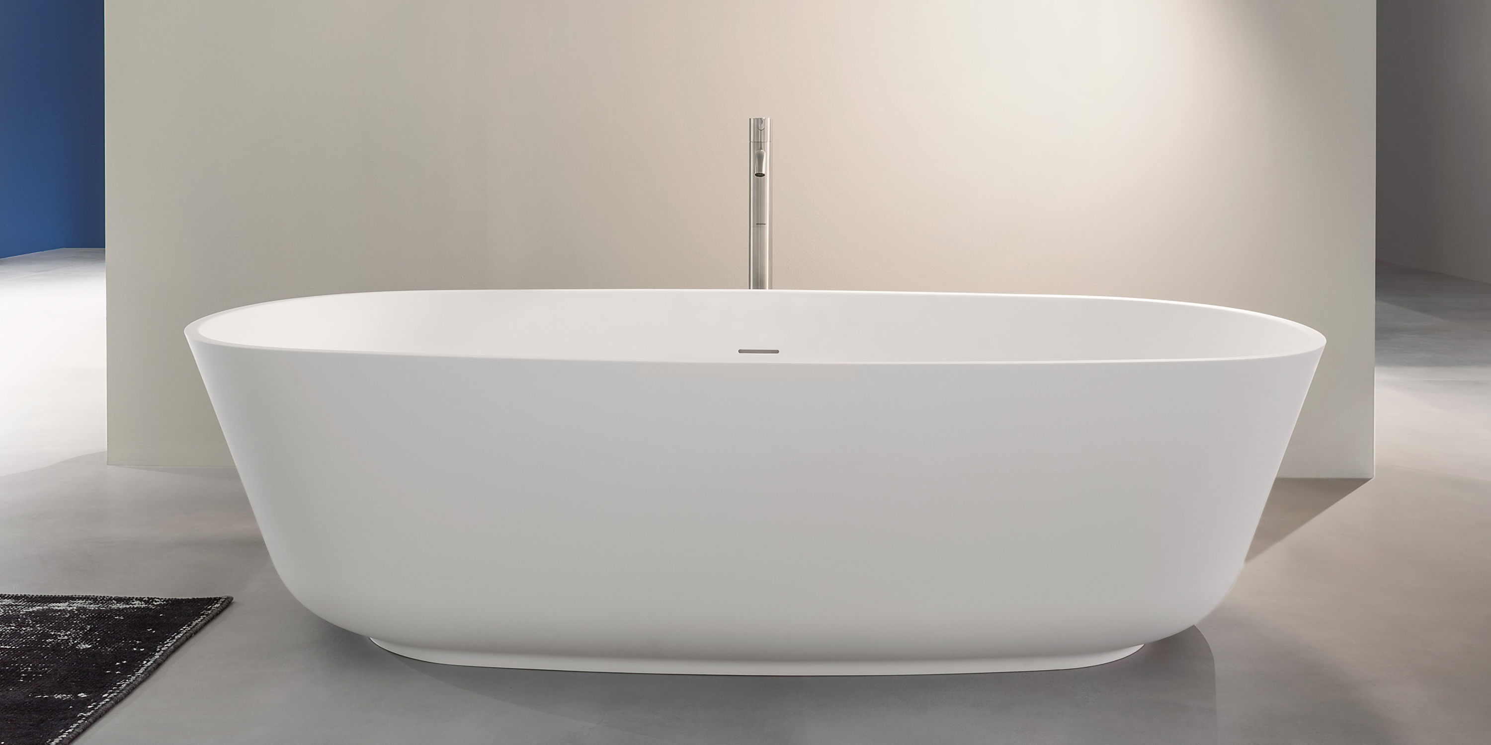 Freestanding bathtub BAÌA ANTONIO LUPI oval / Solid Surface / stone