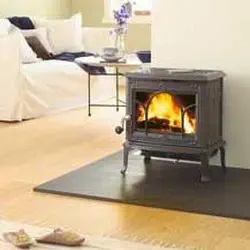 Wood heating stove - F 100 - Jøtul - 5 kW...10 kW / traditional / cast iron