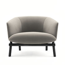 Contemporary armchair / leather / fabric...
