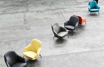 Contemporary armchair / leather / fabric...