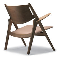 Contemporary armchair / leather / by Hans...