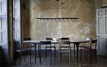 Contemporary dining table / steel / plaster...