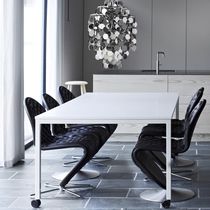 Contemporary dining table / laminate / metal...