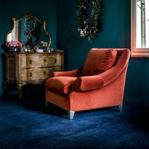 Contemporary armchair / leather / fabric...
