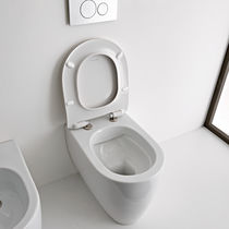 Free-standing toilet / ceramic