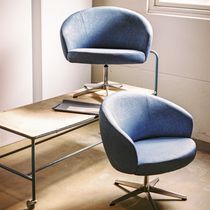 Contemporary armchair / leather / fabric...