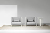 Contemporary armchair / leather / fabric...