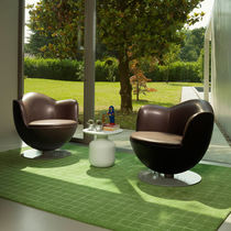 Contemporary armchair / leather / fabric...