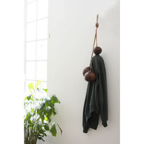 Contemporary clothes rack / leather