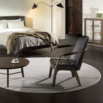 Contemporary armchair / leather / solid...