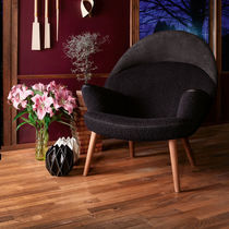 Contemporary armchair / leather / fabric...