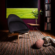 Contemporary armchair / fabric / solid wood...