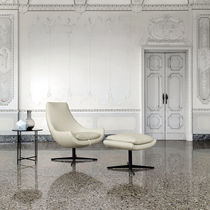 Contemporary armchair / leather / fabric...