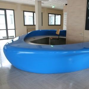 semicircular reception desk / expanded polystyrene