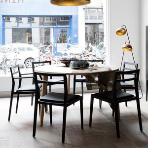 contemporary chair / upholstered / with armrests / leather