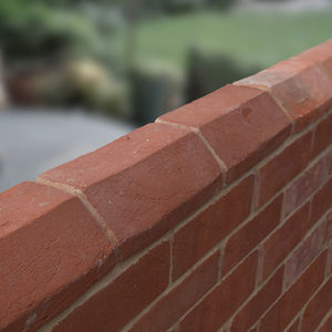 special brick / wall-mounted / red / handmade