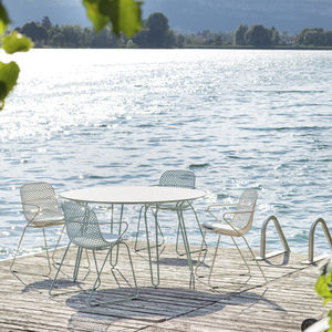 contemporary chair / with armrests / stackable / sled base