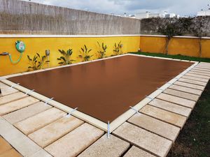 grommeted swimming pool cover 1