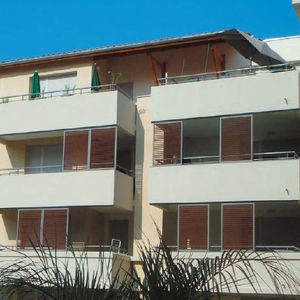 sliding shutters / wooden / for facades / louvered
