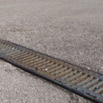 cast iron drainage channel / polymer concrete / with grating / for public spaces