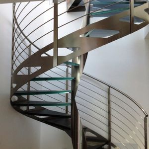 spiral staircase / stainless steel frame / glass steps / without risers