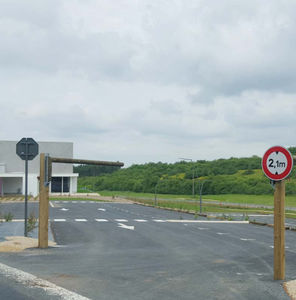 pivoting height-restriction barrier