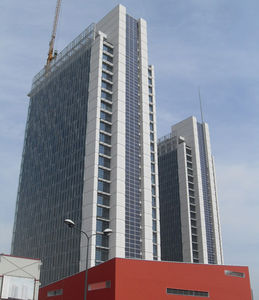panel curtain wall / metal and glass / stone