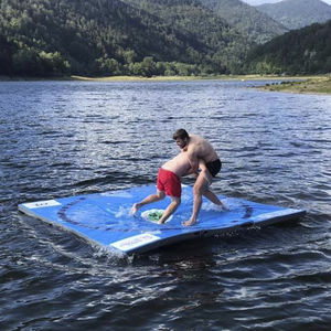 wrestling mat on water