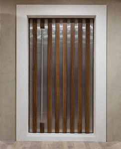 entry door / pivoting / stainless steel / walnut