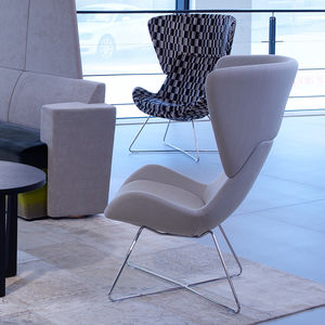 contemporary fireside chair / fabric / sled base / with footrest