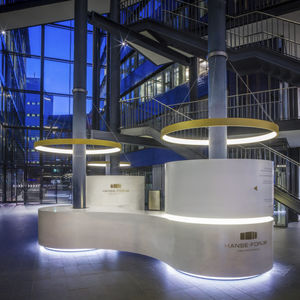 curved reception desk / concrete / illuminated