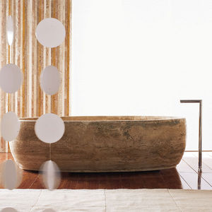free-standing bathtub / natural stone