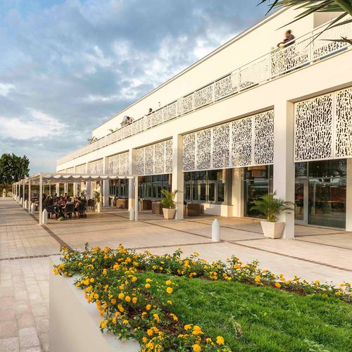 Exterior fitting decorative panel - CELLON - MARRIOTT PORT-AU-PRINCE HAITI - Bruag Design Factory AG - wall-mounted / HPL / perforated
