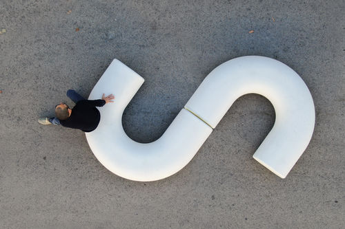 Contemporary public bench - Cinnamon Curve - Durbanis - concrete / without backrest / modular