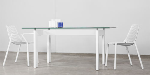 Contemporary dining table - GOLDEN - MASIS - glass / solid wood / rectangular